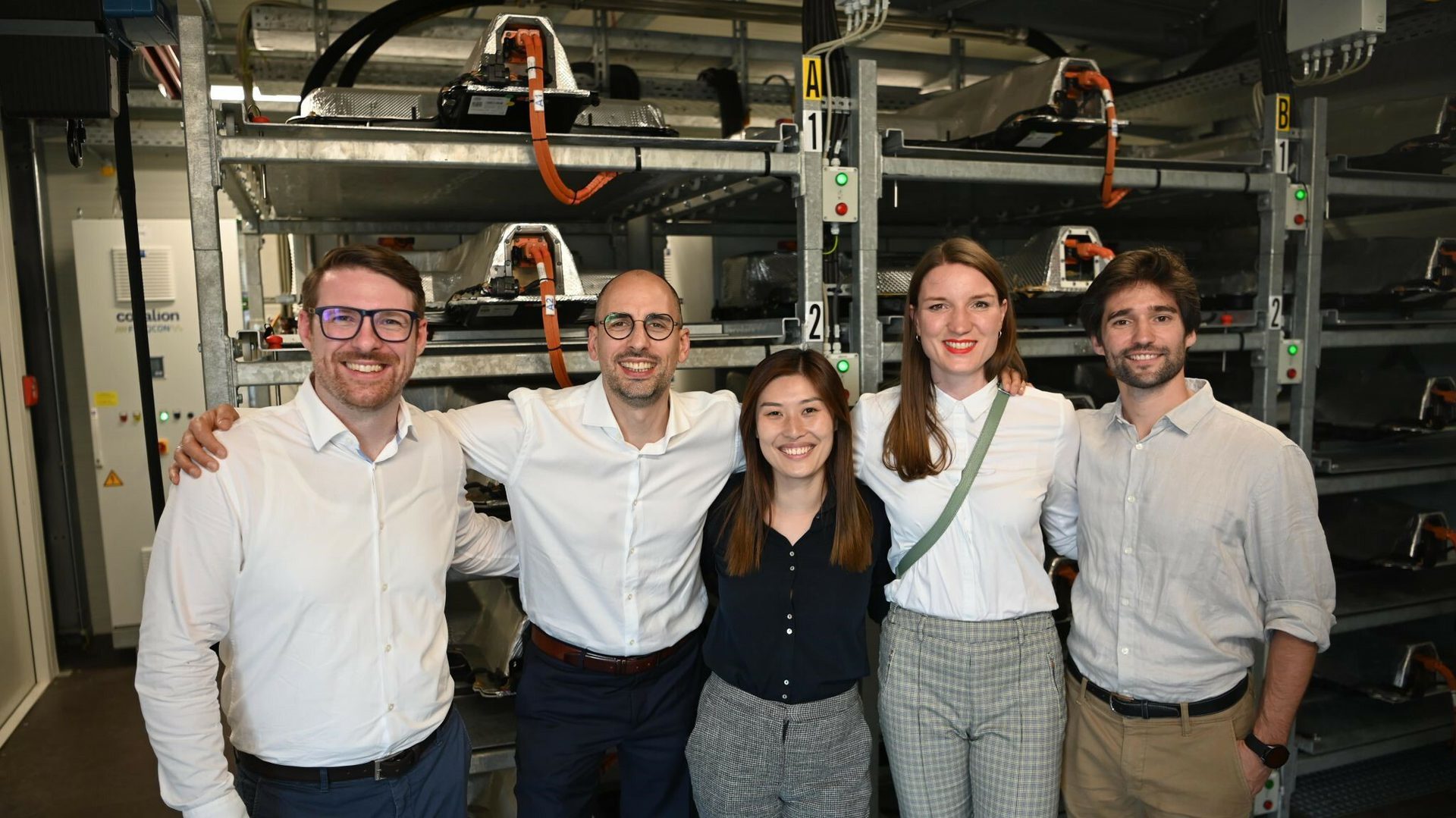 Group photo of of five people standing together. From left: Leon Gosh, (CEO Cellect), Ingo Müller, (Vice President Elli), Lele Zheng, (Project Manager Origination Elli), Luisa von Lonski, (Head of Energy Flexibility Trading Elli), Llorenç Garcia Ibars, (Project Manager Elli).