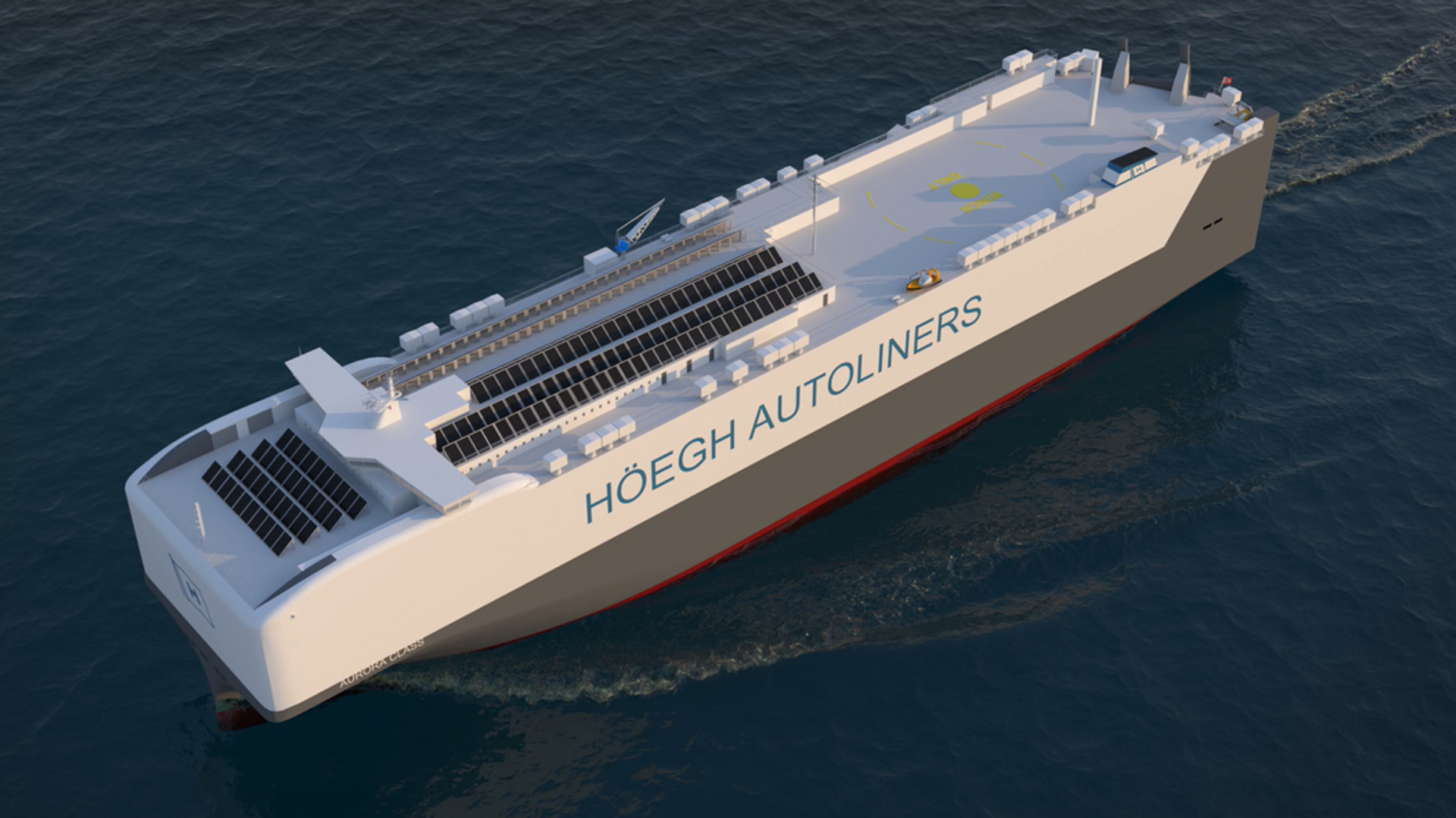 A large cargo ship with the name "Höegh Autoliners" written on the side, sailing on calm waters. The ship is equipped with solar panels on its deck, indicating an emphasis on renewable energy.